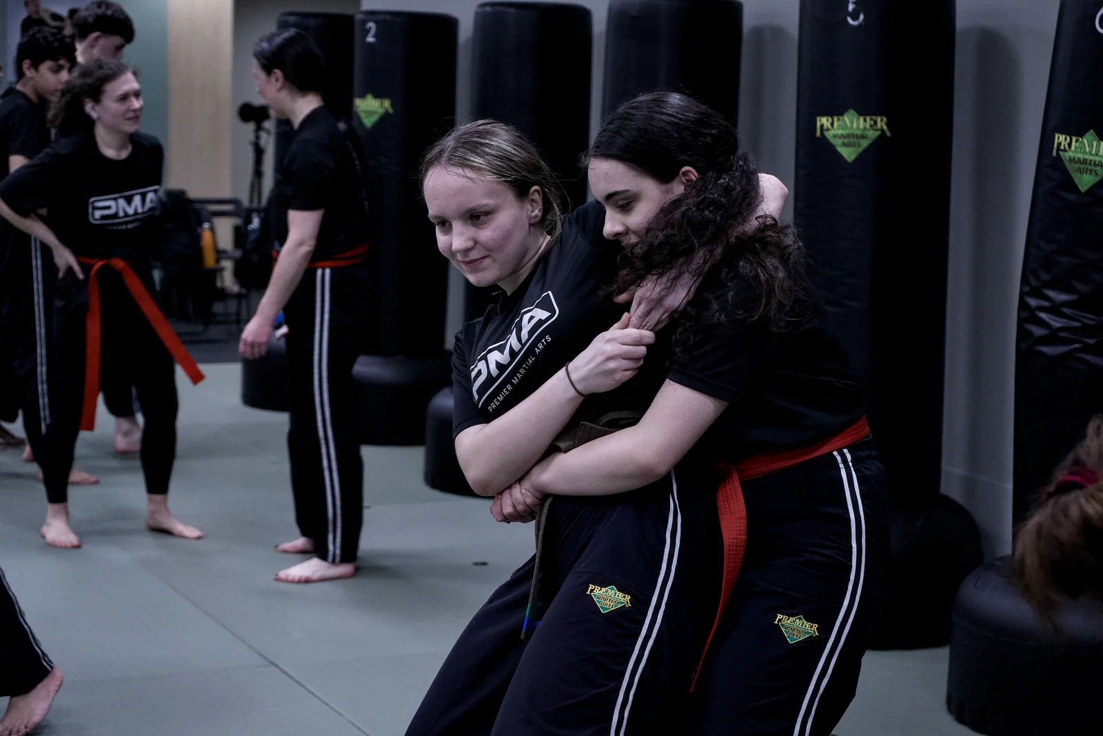 Two children practising a self-defence escape from behind
